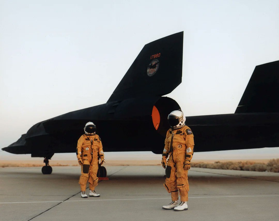 The crew of a NASA Lockheed SR-71 Blackbird standing by the aircraft in their pressurized flight suits (1991)